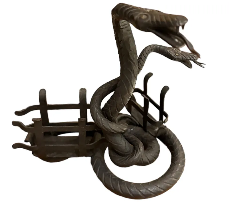 Antique card tray featuring a serpent design in the center.