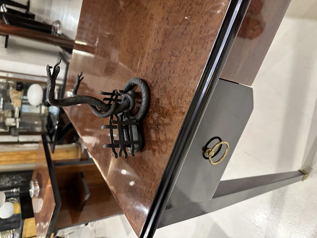 Antique card tray with decorative sculpture, in vintage setting.