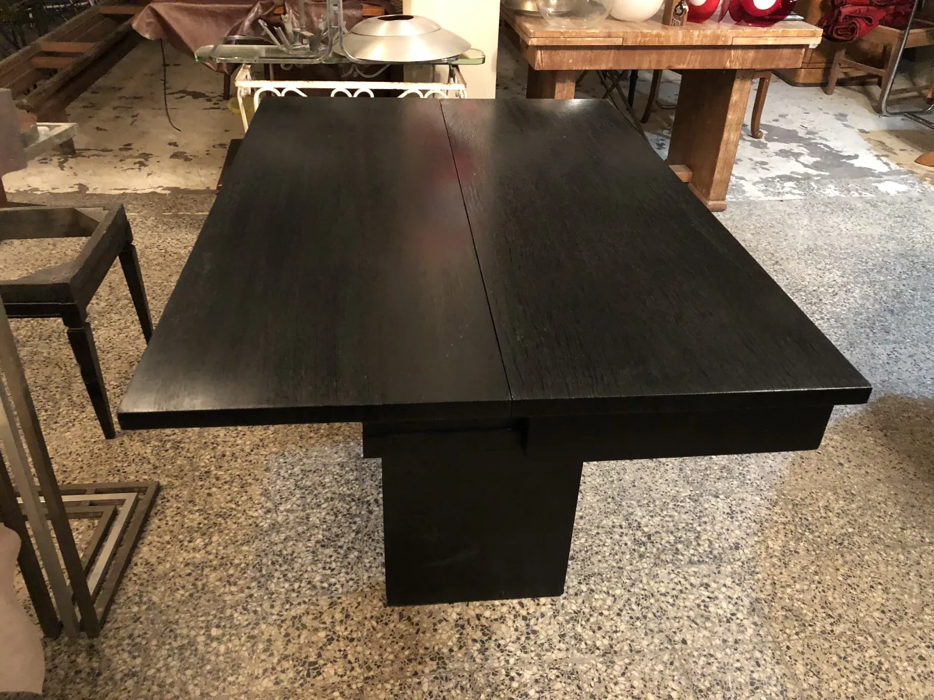 antique consoles in a home setting, black furniture, simple legs