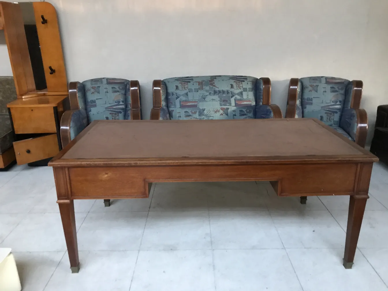 antique desk with chairs in the background and classic setting