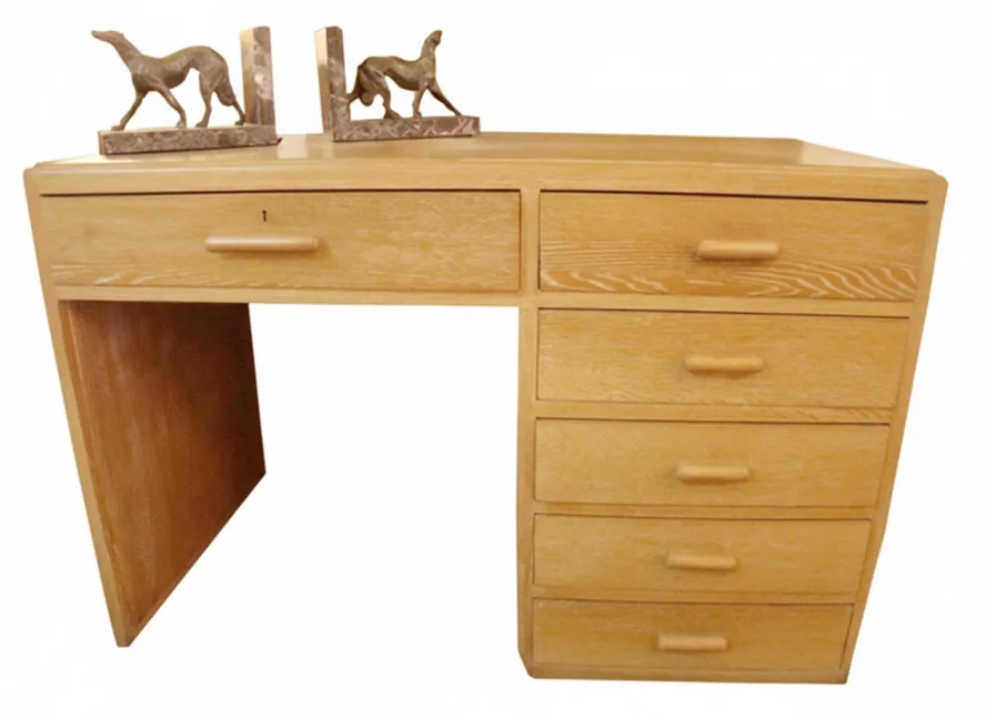 antique desk with drawers and dog figures