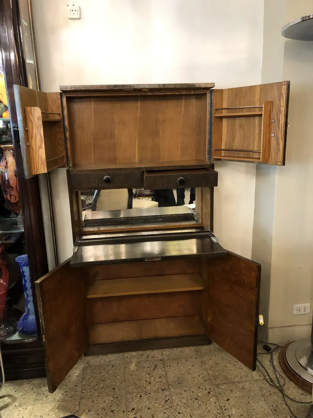 Antique bar with a mirror and storage space