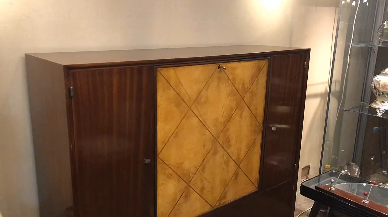 antique bookcase with yellow and brown details