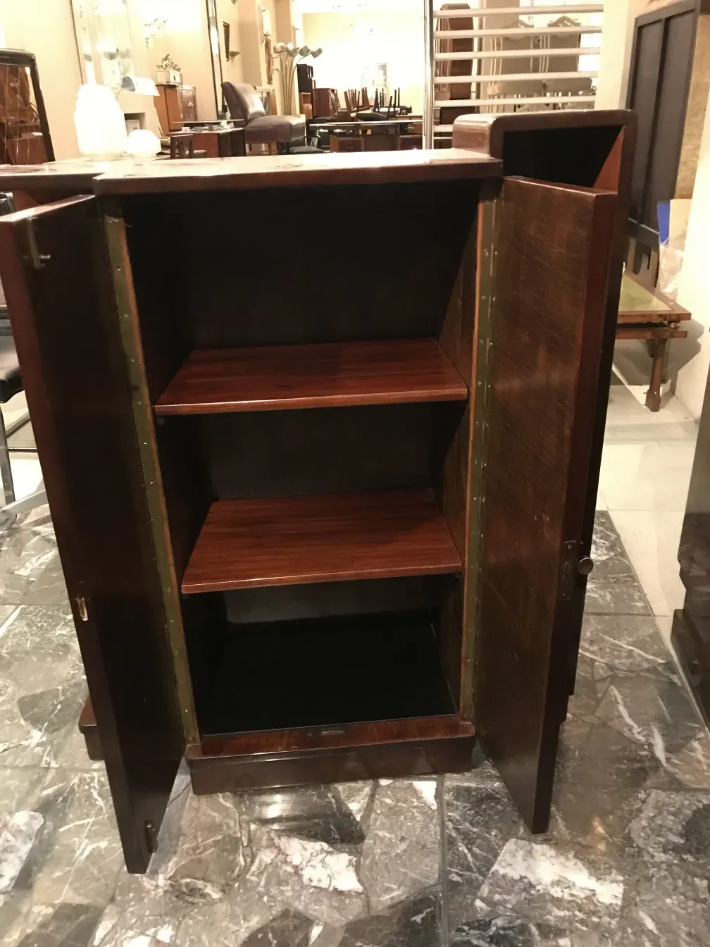 Antique bookcase with empty shelves in an elegant environment.