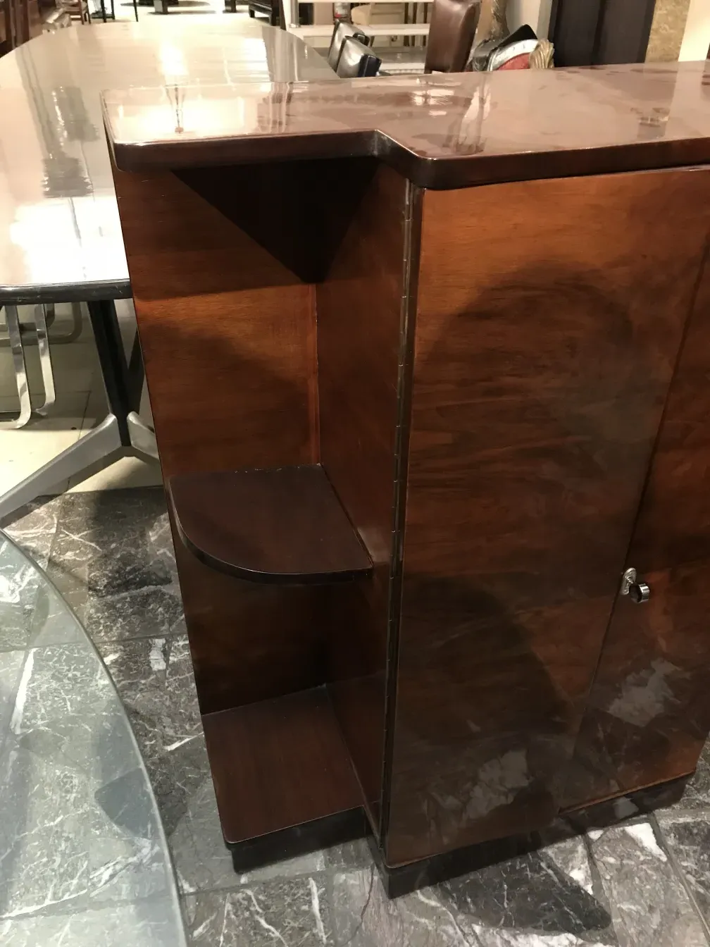 Antique wooden bookcase with elegant details in a cozy environment.