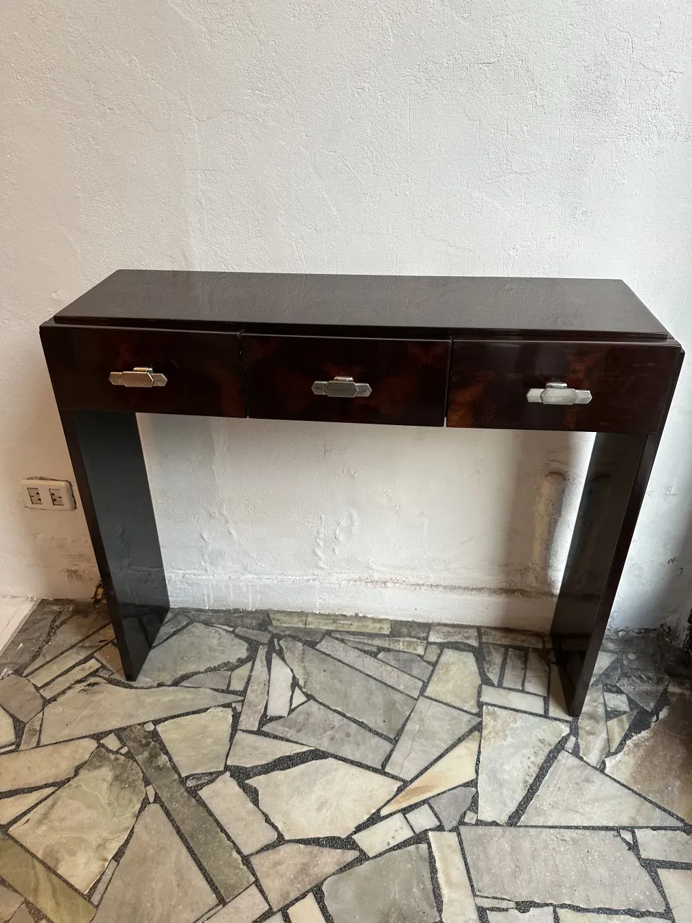 two antique consoles with three drawers in dark shade