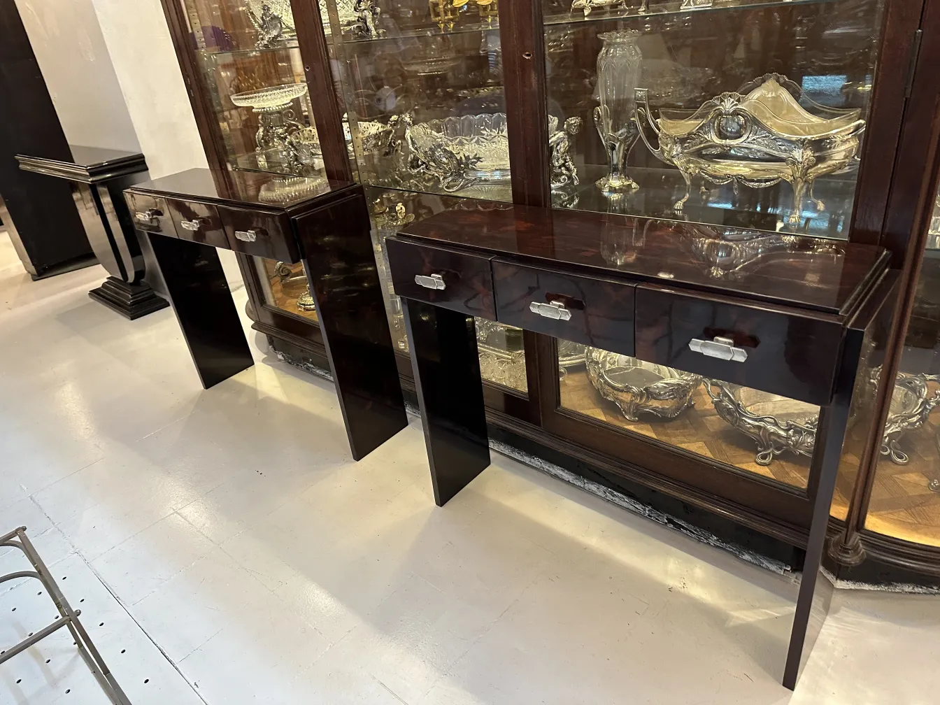 two antique consoles with drawers, presented elegantly