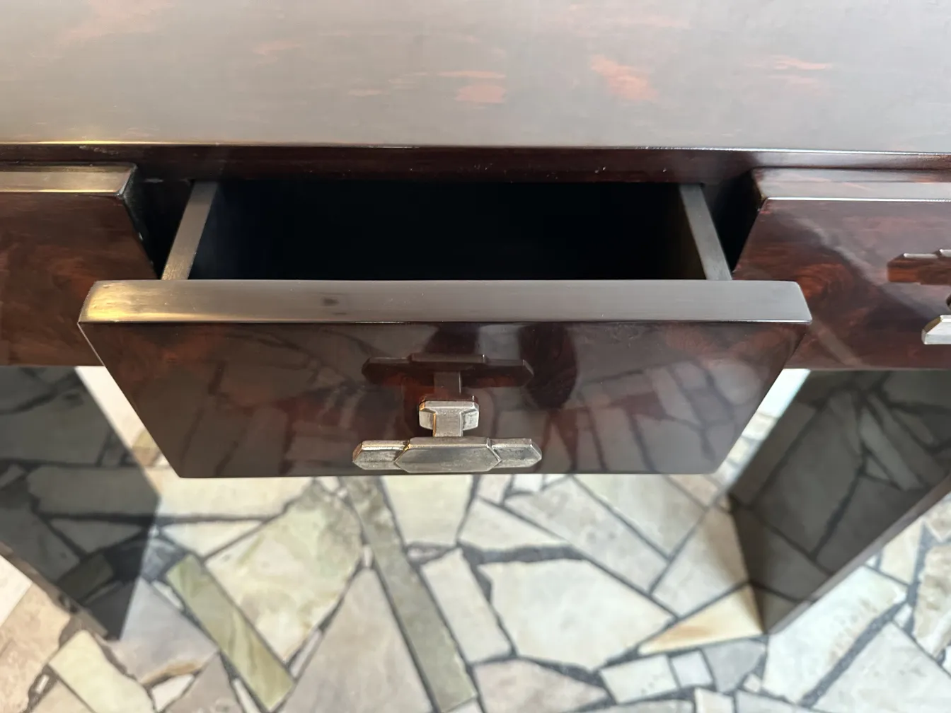 detailed view of two antique consoles with open drawers