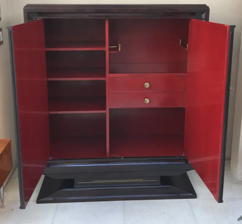 antique bookcase with red shelving and two drawers