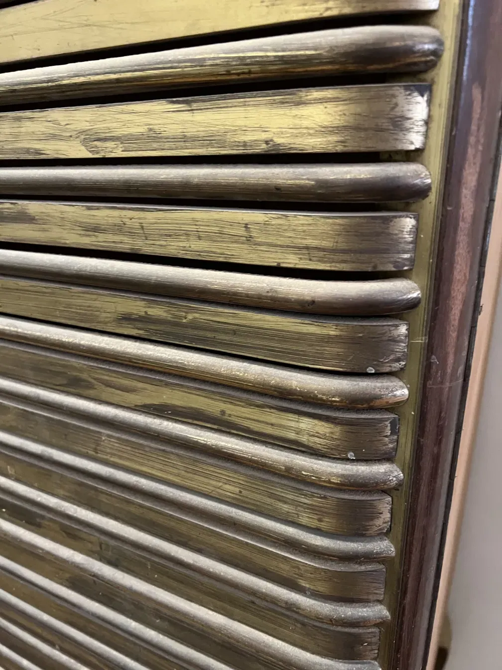 Antique bar cabinet featuring distinctive decorative details.