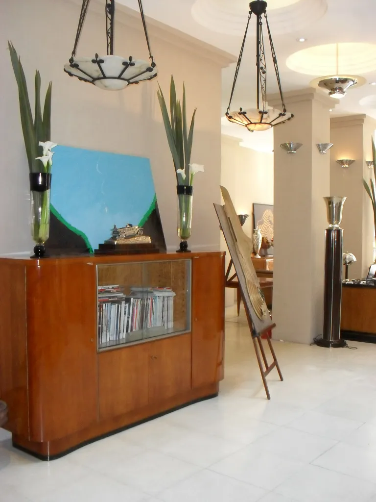 antique bookcase with elegant design and decorative plants