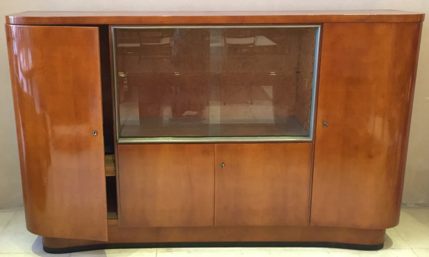 Antique wood bar cabinet featuring a glass display.