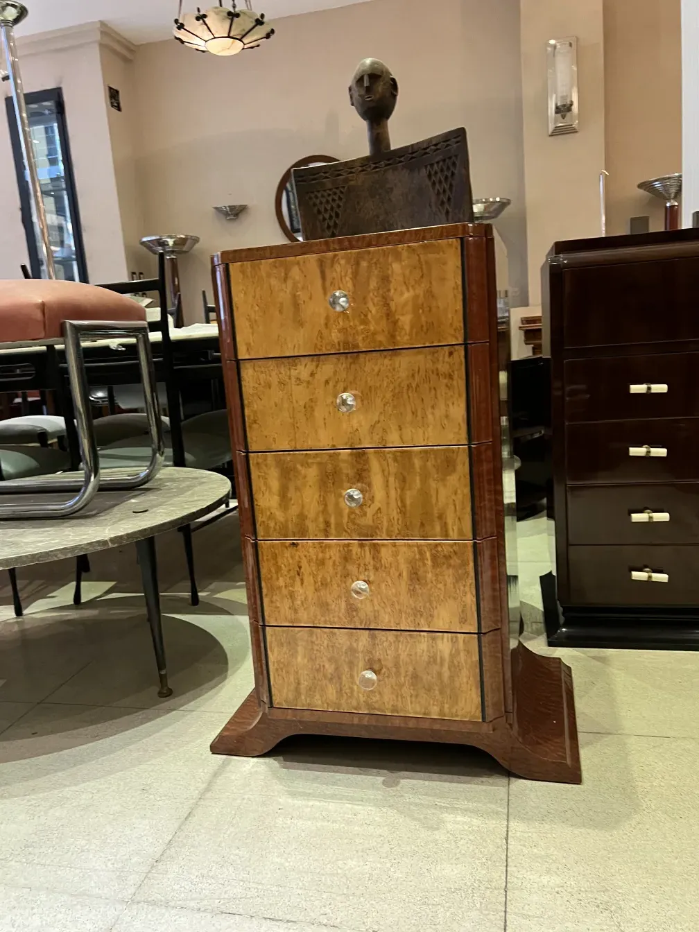 Antique wooden cabinet with four drawers and glass handles