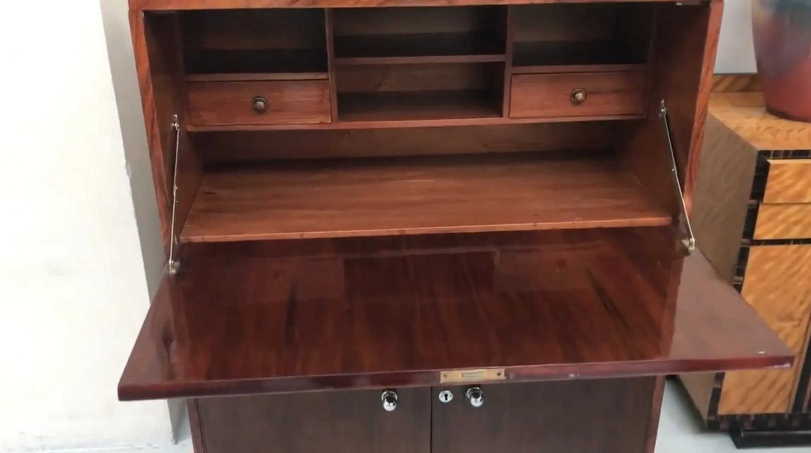Antique desk featuring two drawers and visible shelves.