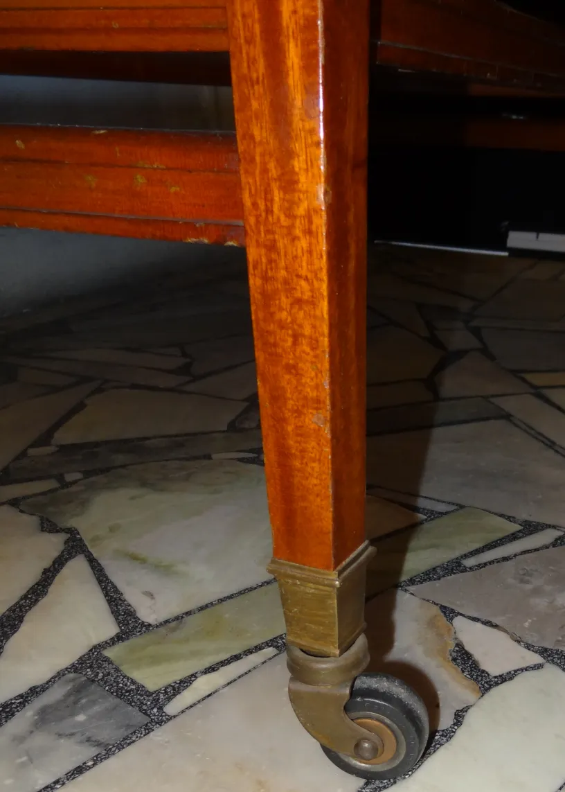 Antique table with wheels, suitable for 4 people, cozy setting.