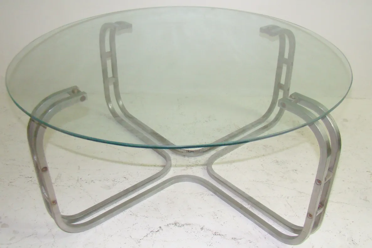 antique art deco coffee table with distinctive base and round surface