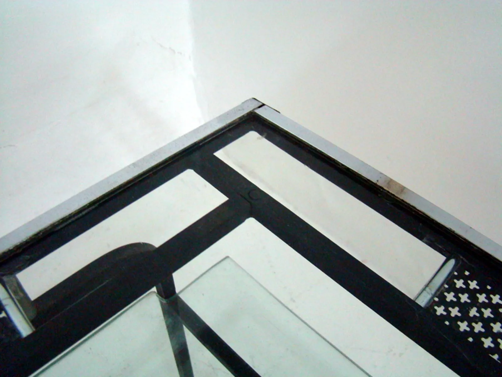 Antique coffee table by Mathieu Matégot featuring glass top