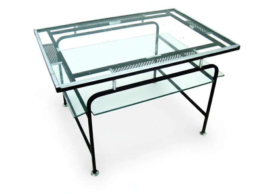 antique coffee table by Matthew Matégot in a modern setting