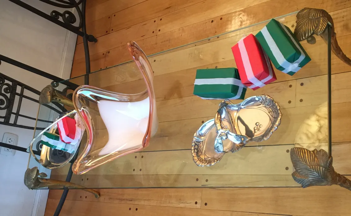 antique coffee table with decoration and colorful gifts