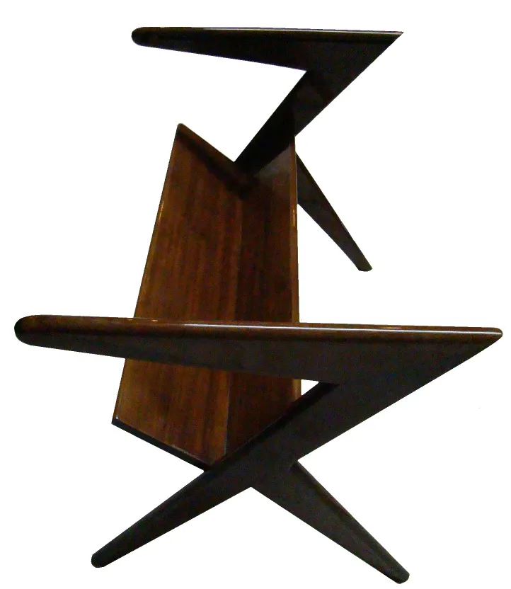 Vintage magazine rack with star-shaped legs, elegant and cozy environment.