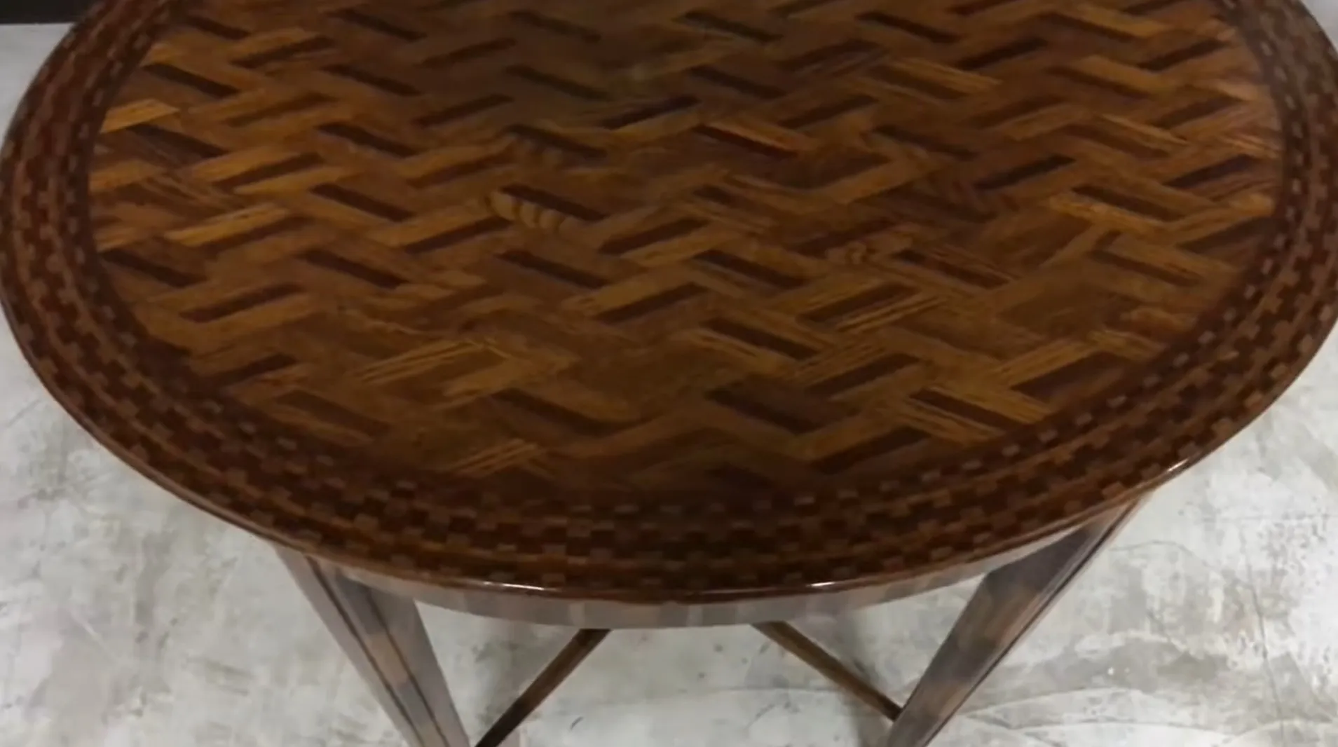round antique small table with intricate surface patterns