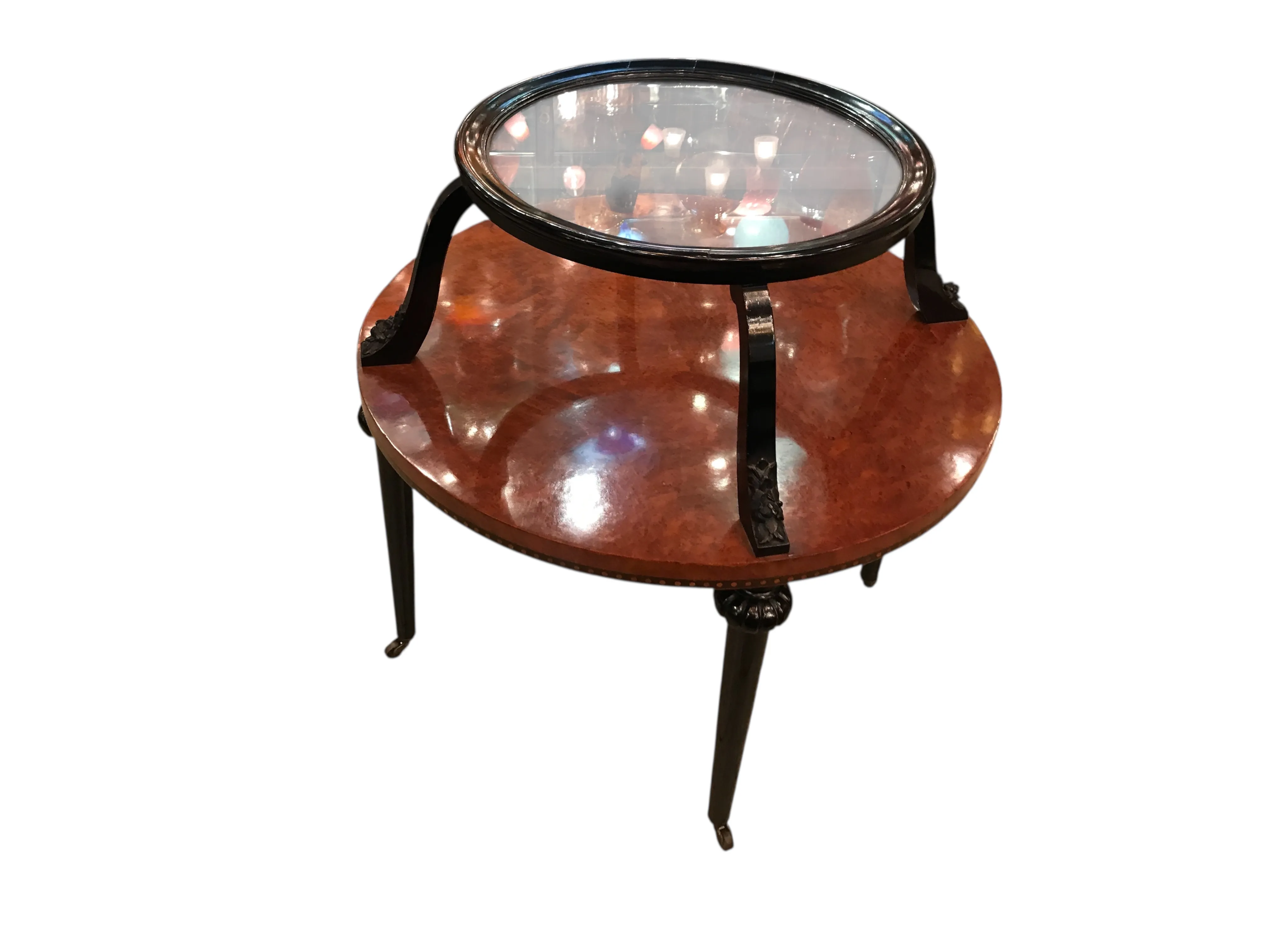 antique round small table with glass top and elegant legs, in a cozy setting