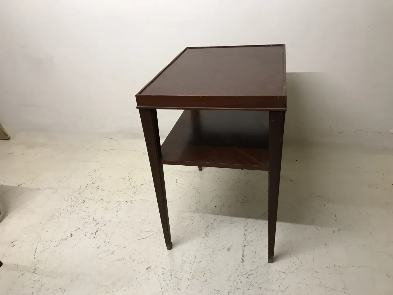 Art deco antique table with lower shelf and elegant design