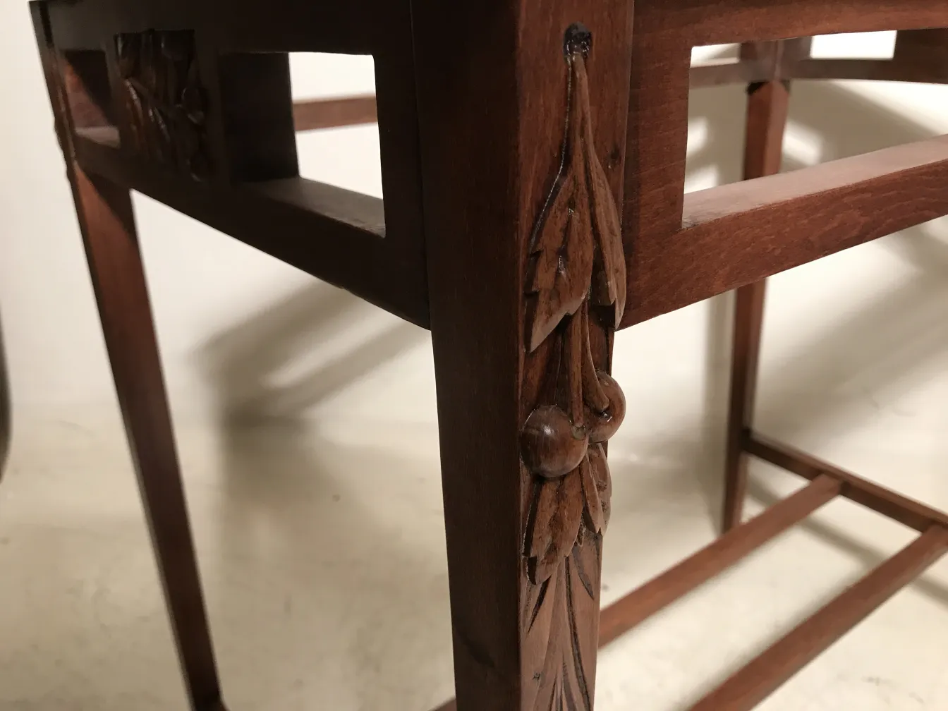antique table with intricate art nouveau designs