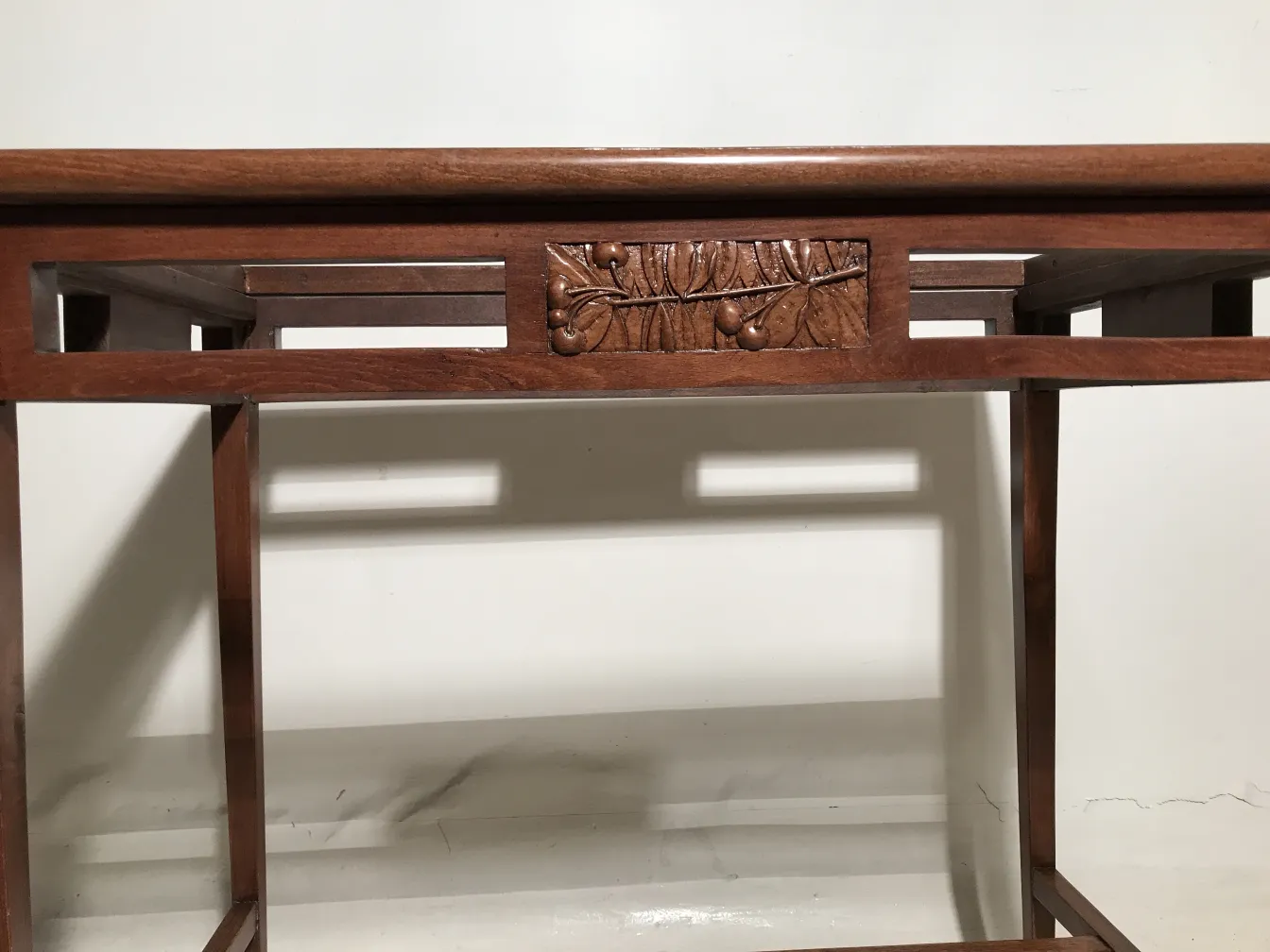 Antique table in Art Nouveau style with intricate carving and elegant setting.