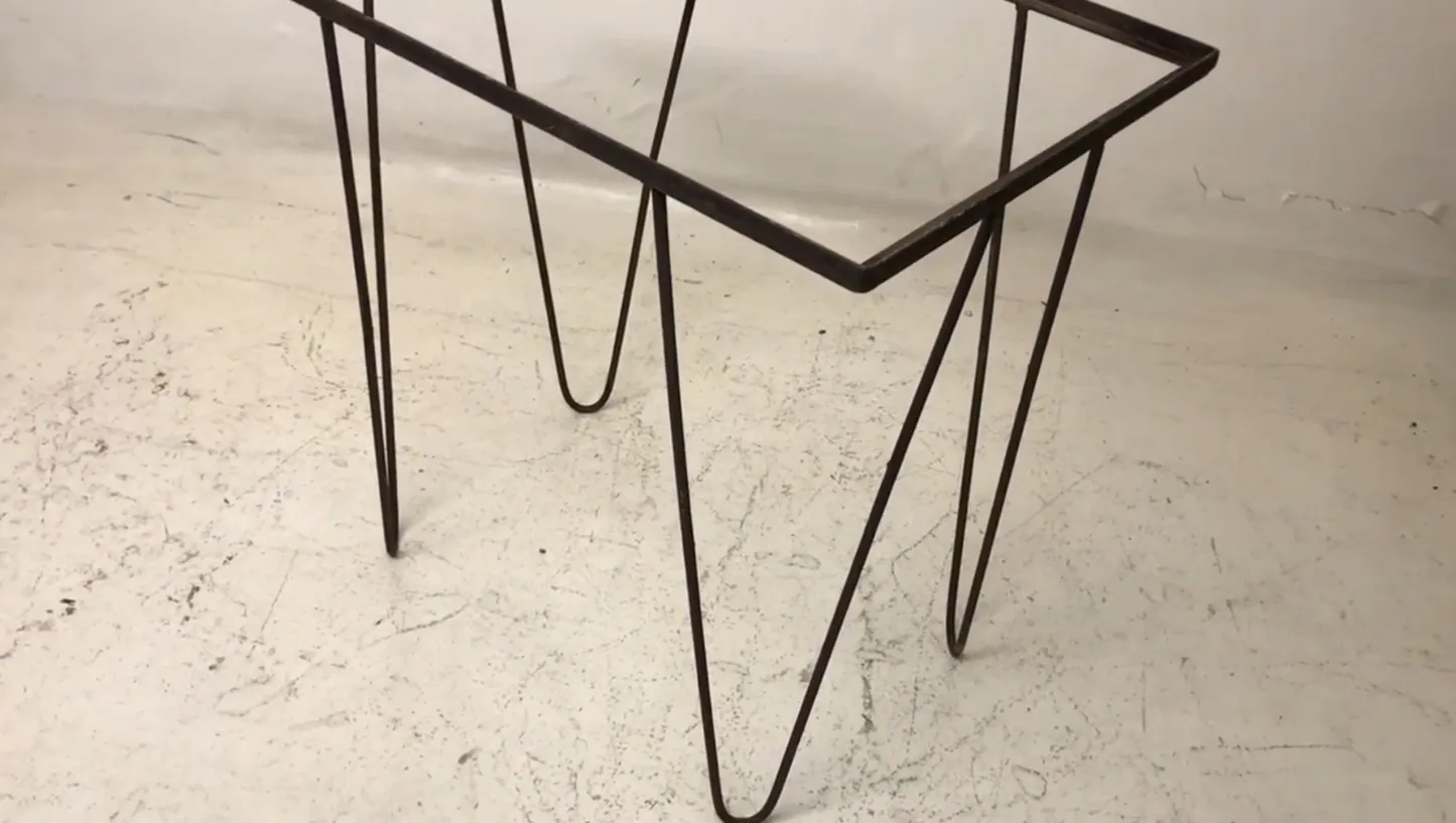 antique decorative table with elegant legs in a garden setting