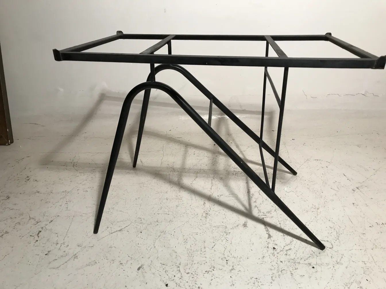 Antique table with unique design for garden, in warm setting.