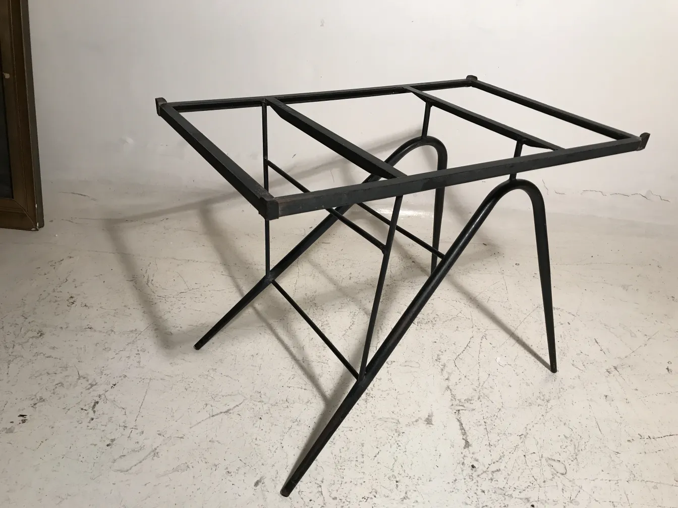 antique garden table with visible structure in neutral backdrop