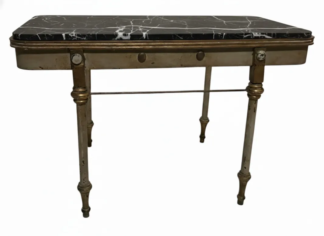 antique garden table with dark surface and decorative legs