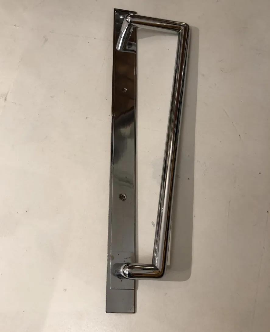 shiny antique door handle with modern design, 1950