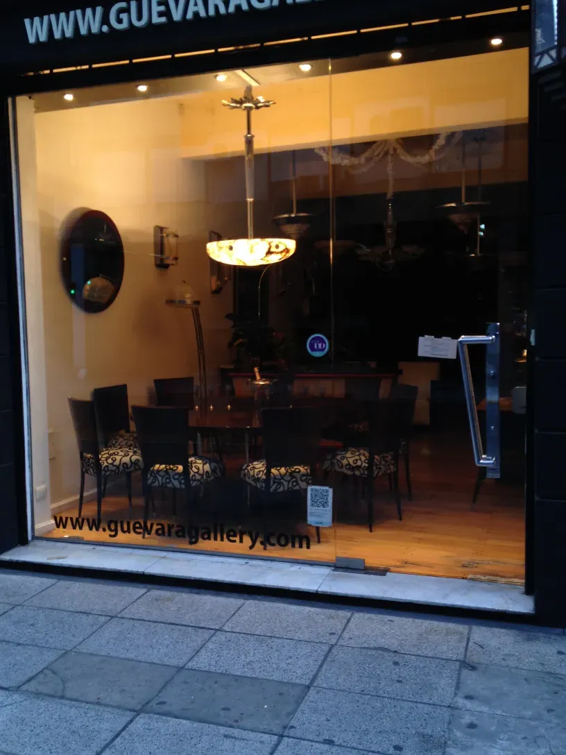 Antique door handles displayed in a charming setting with diverse furniture.