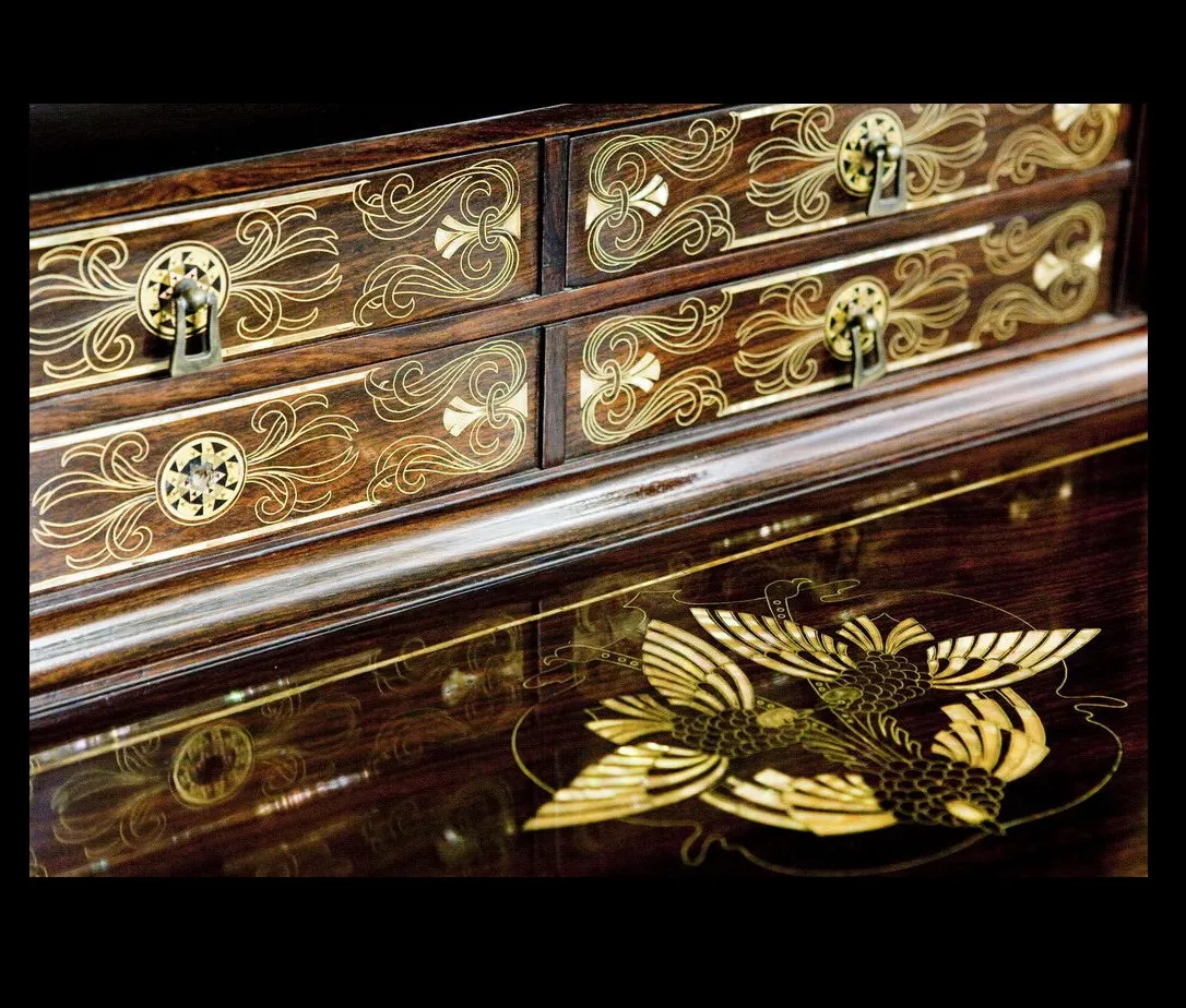 antique desk with gold details and elegant design