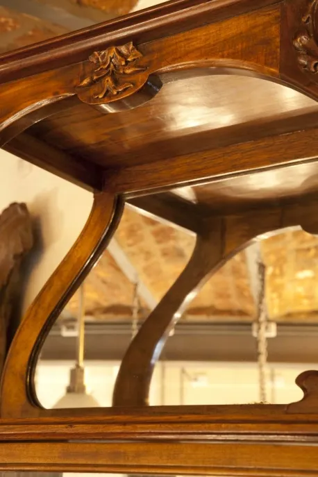 antique display cabinet with decorative edge details