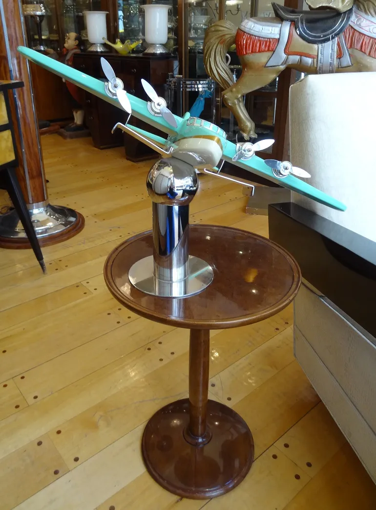 antique nordiska kompaniet table with decorative airplane