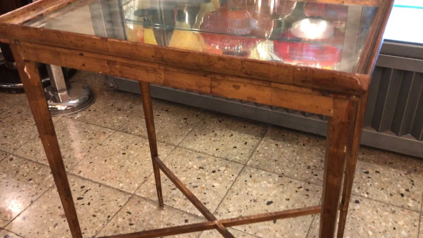 antique rectangular table with glass surface, cozy environment