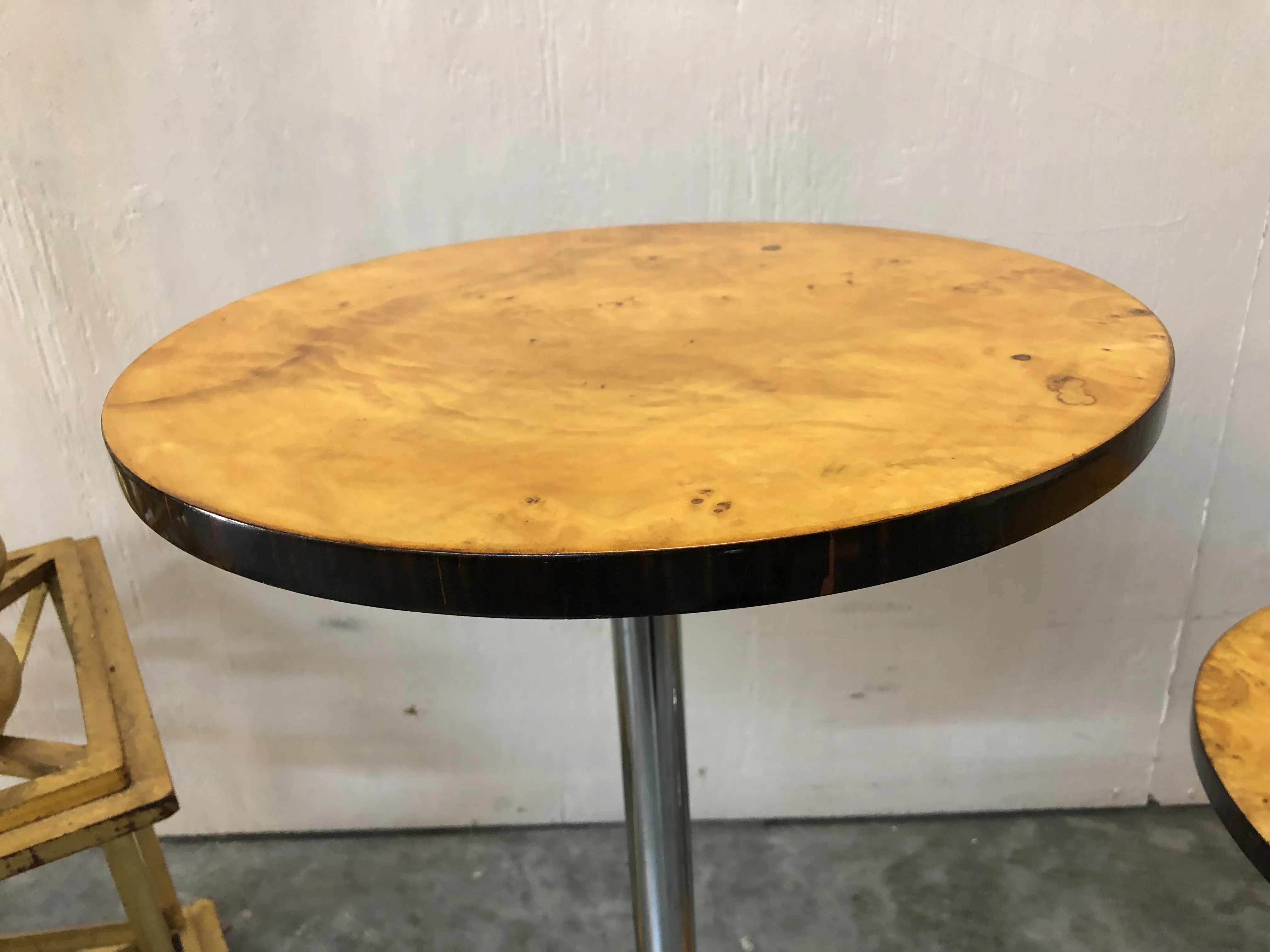 antique round small table with a shiny surface in a simple environment