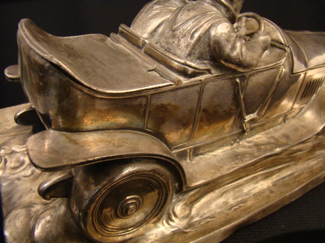 Antique WMF inkwell shaped like a car with motion details