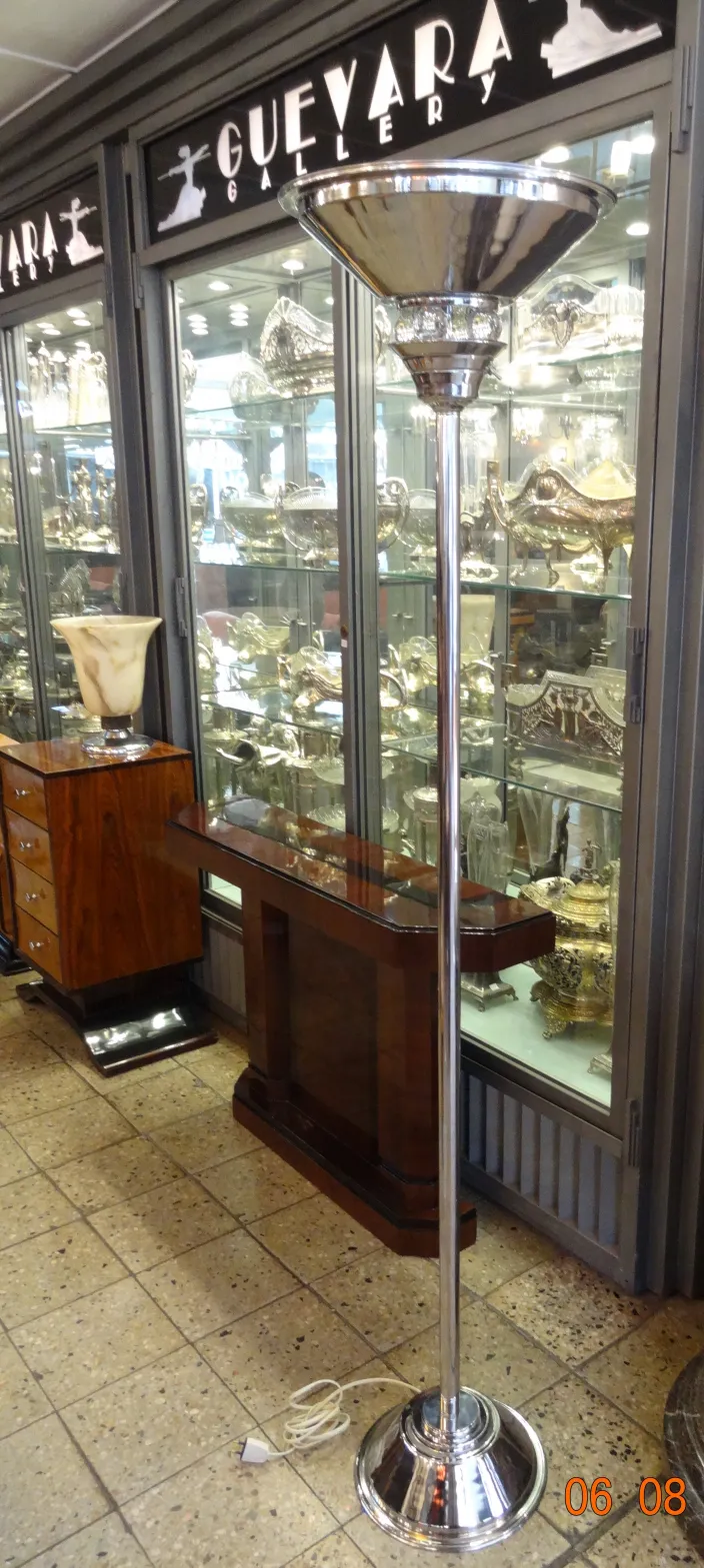 2 art deco floor lamps in an antique gallery