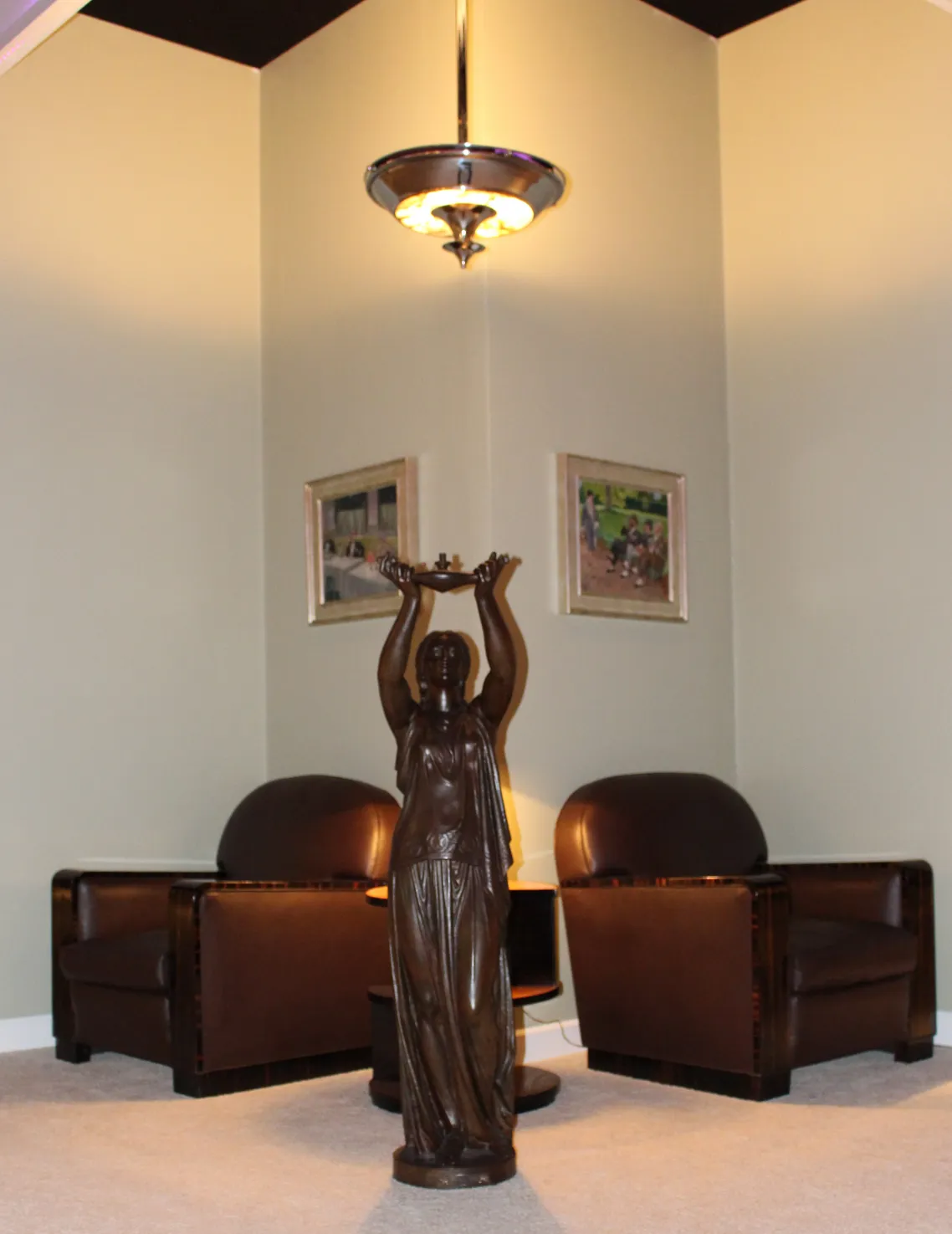 View of 2 antique hanging lamps in a cozy setting