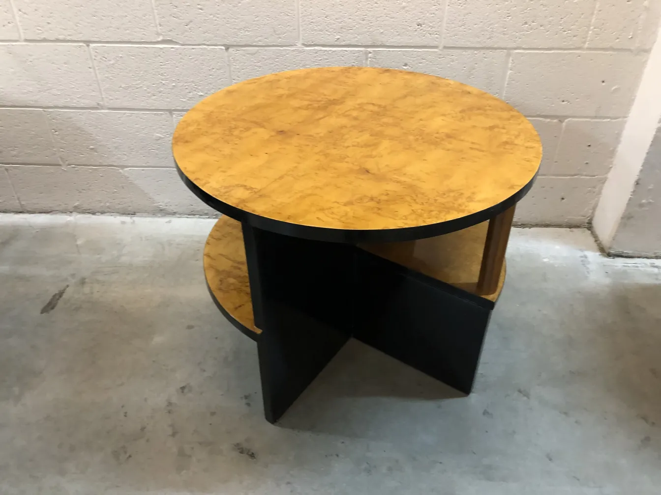 two antique round small tables in art deco style in a simple space
