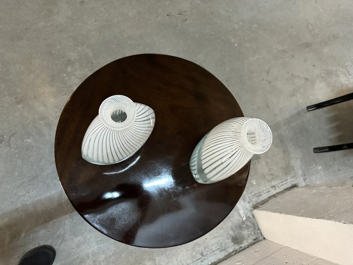 two antique murano vases on a table