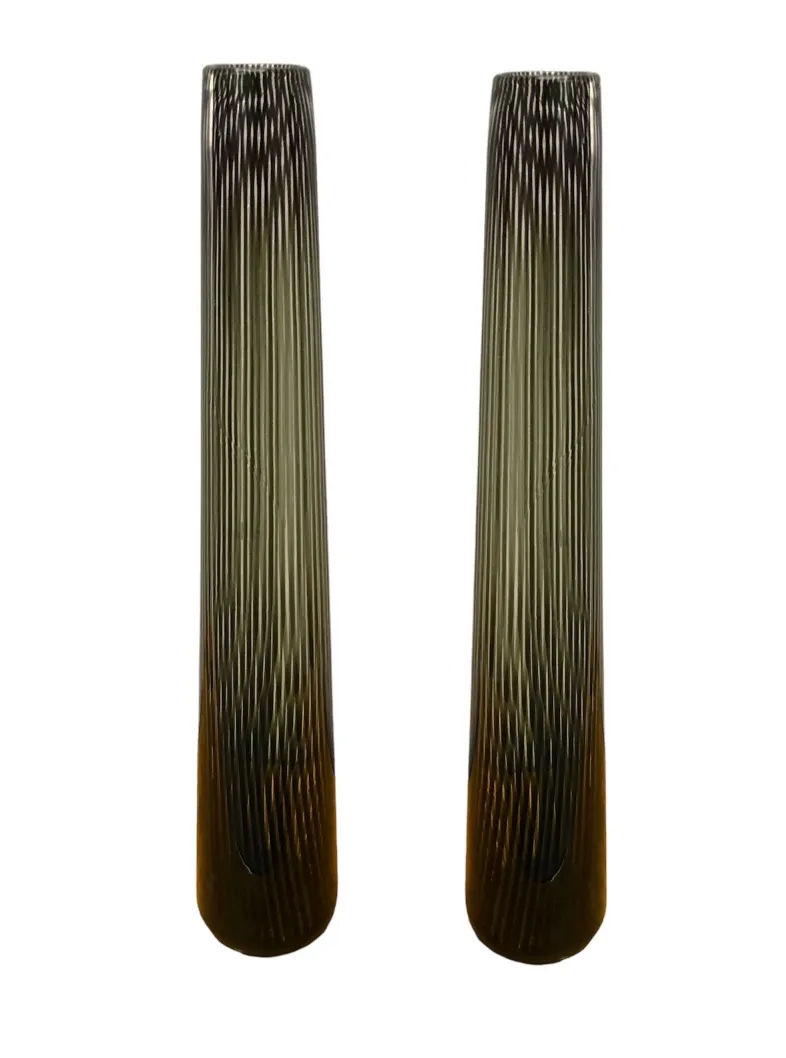 two antique Murano vases with an elegant vertical design, in a classic setting.