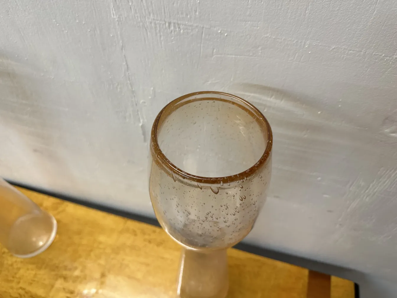 2 antique murano vases with water droplets and bright background