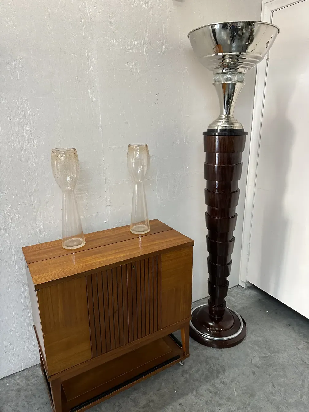 Two antique murano vases on a light background