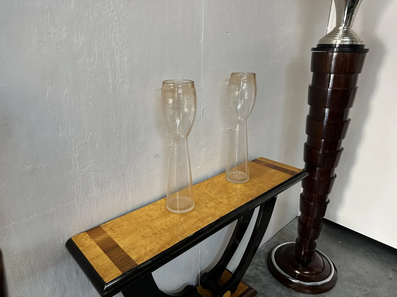 two antique murano vases on a light wooden table