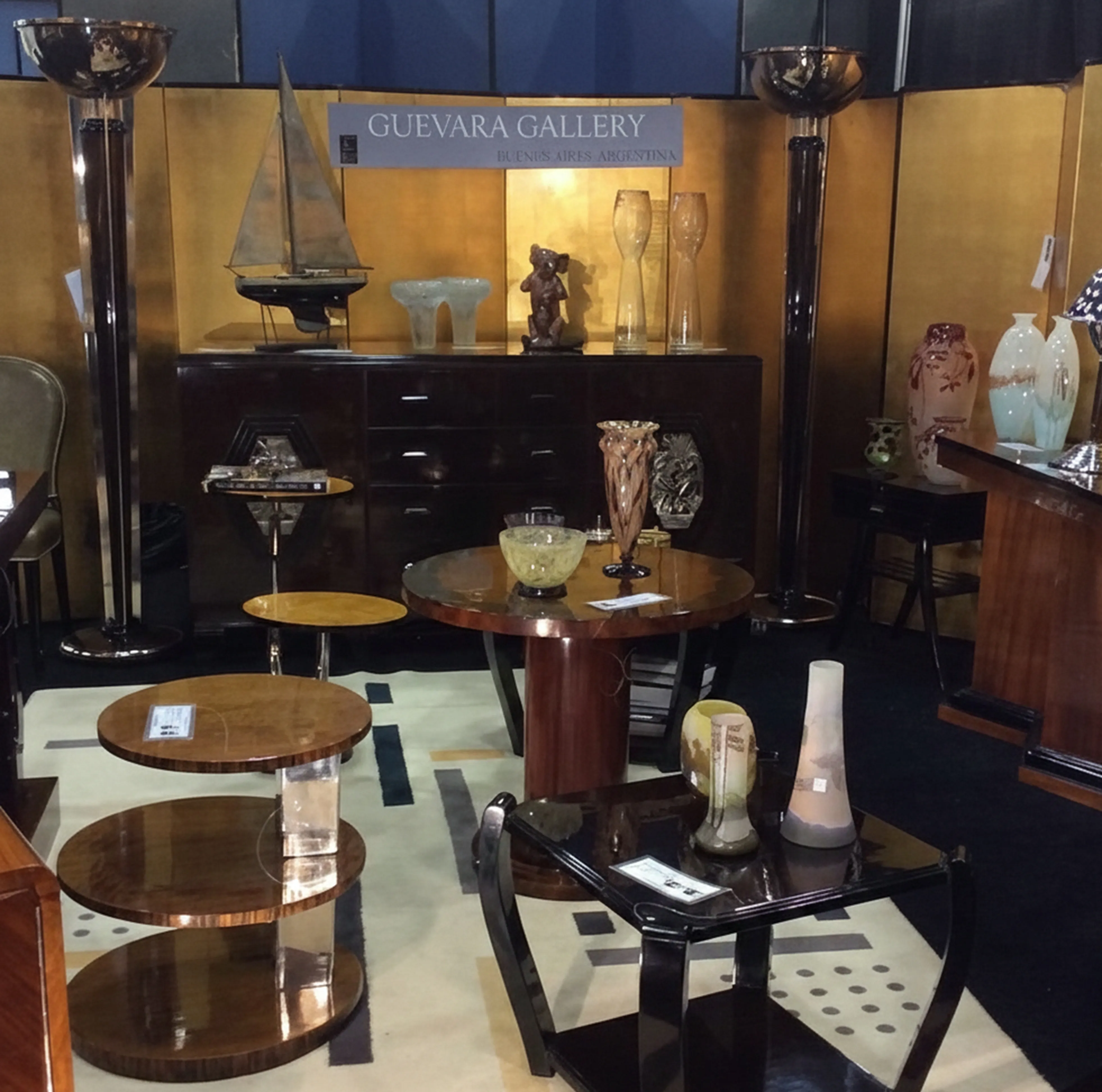 Antique ship in a gallery surrounded by collectibles